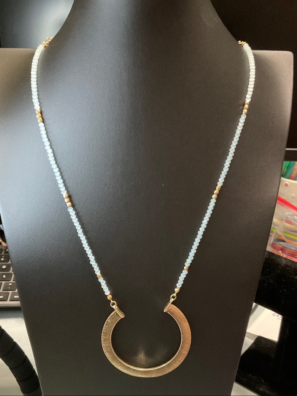 Gold Crescent Pendant Necklace with Pale Blue Beads
